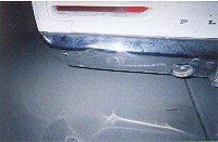 Small dent in rear bumper.